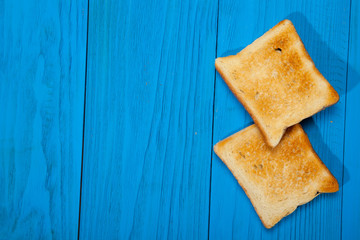 Toast on a wooden blue background