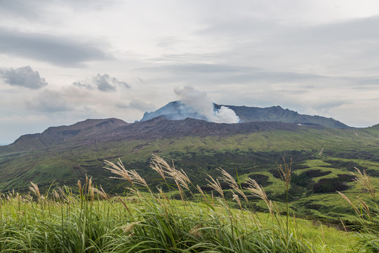 Erupting Mount Aso volcano view from natural trail in Kumamoto,  Kyushu, Japan