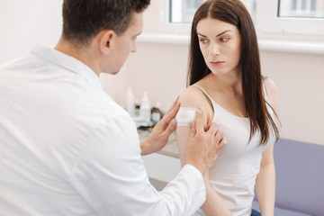 Fototapeta premium Sad unhappy woman receiving medical help