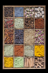 wooden box with spices and herbs