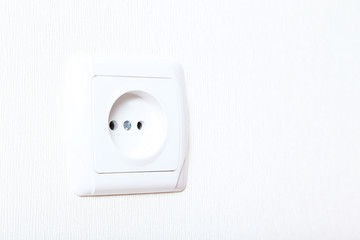 Electrical socket on a white wall