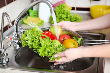 Vegetables washing in the kitchen