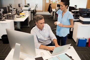 High angle view of businesswoman standing by 