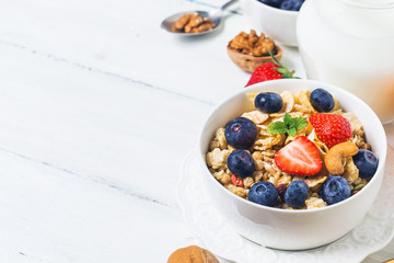 crunchy flakes with blueberries and various yogurts for healthy breakfast, close-up