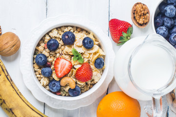crunchy flakes with blueberries and various yogurts for healthy breakfast, close-up