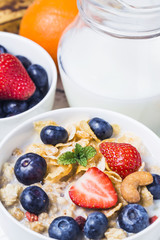 crunchy flakes with blueberries and various yogurts for healthy breakfast, close-up