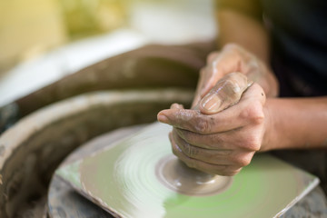 Fototapeta premium This man is using pottery glass