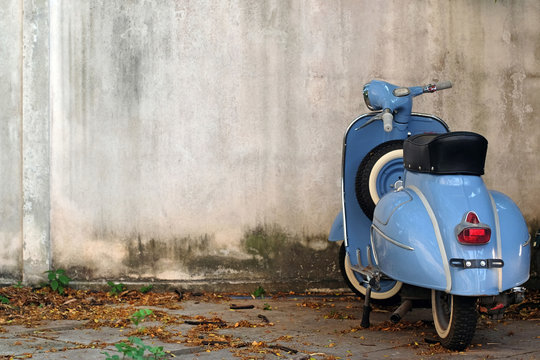 Blue Retro Scooter on old wall