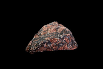 Granite stone red color isolated on black background.