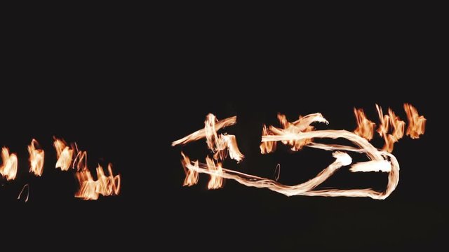 Closeup of fire flames from fire show at night - video in slow motion