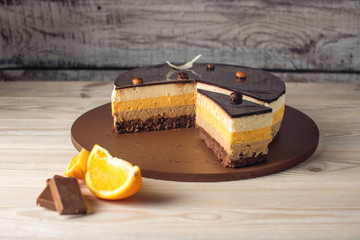 Orange chocolate cake with layers of delicate souffle, homemade dessert - Powered by Adobe