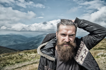 man hipster with beard in mountain top