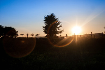 lens flare with sunset grave yard - 145773735