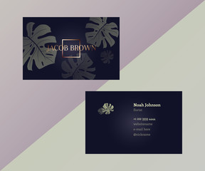 Template of double sided business card in trendy colors. Graphite gray and gold. Monstera leaves. The cover and reverse side. Strict style. Suitable for use for example floral company.