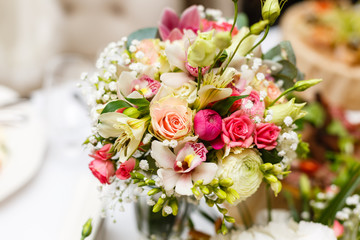 elegant wedding bouquet on table at restaurant