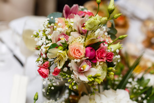 elegant wedding bouquet on table at restaurant