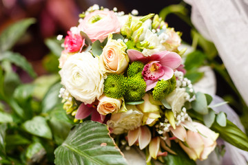 elegant wedding bouquet on table at restaurant