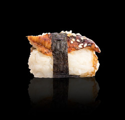 Nigiri Sushi with Smoked Eel and Seaweed Nori on Dark Background