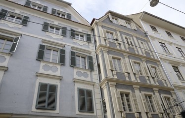 Grey and blue buildings  in Graz, Austria.