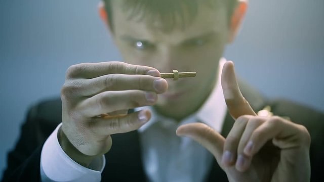 Magician showing a magic trick with bolt