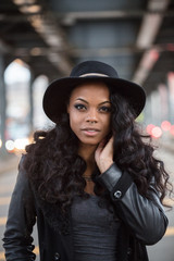 A portrait of a young, black woman, posing in the streets of Brooklyn, New York City.