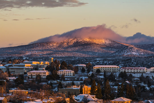 Small Mountain Town College Lightly Covered With Snow At Sunset