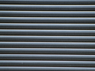 Texture of a gray blind on a house