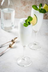 Italian summer alcoholic cocktail Sgroppino  - from ice cream, vodka and wine. Two servings in glasses. On a light background. Copy space