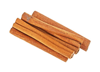 Pile of cinnamon sticks on a white background