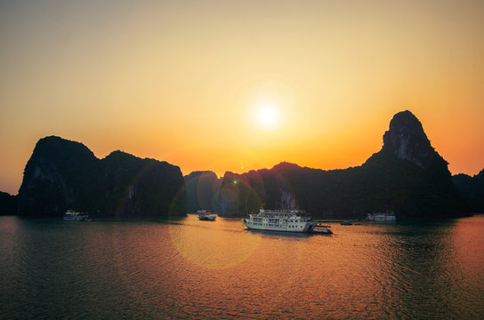 Sunrise and ruise boats on Halong bay, Vietnam