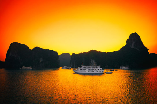 Sunrise and ruise boats on Halong bay, Vietnam