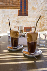 Latte Macchiatos served in old cafe in Greece
