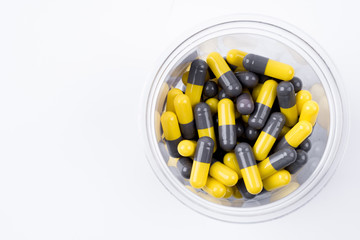 pile of medical pills and pills on white background.