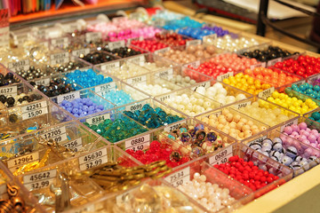 Assortment of beads in boxes at shop