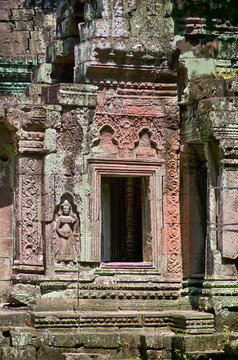 Khmer classical dancers shown in stone - An Apsara (also spelled as Apsarasa) in Banteay Kdei temple in Angkor, Siem Reap, Cambodia.
