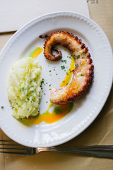 Grilled octopus with potato puree and pepper oil