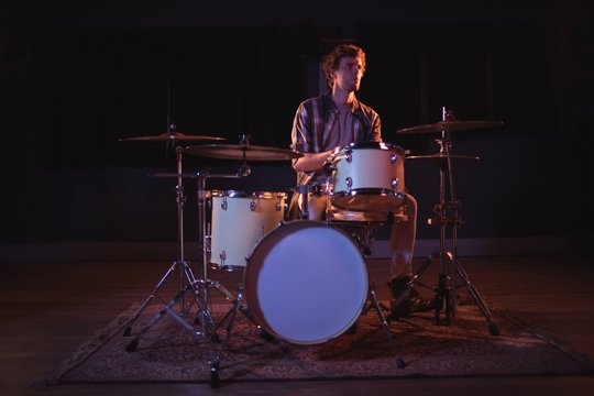 Drummer playing on drum set
