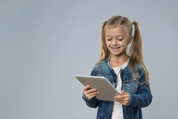 Little Teenage Girl Using Tablet Computer, Small Kid Happy Smiling Child Isolated Over Gray Background