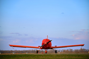 Small  aircraft in the parking lot of the airfield.