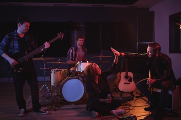 Band mates giving high five to each other