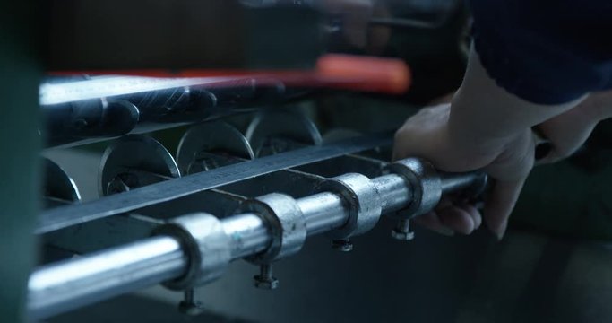 Person uses socket wrench, close up
