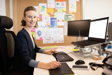 Portrait of businesswoman working at office