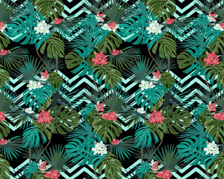 Exotic seamless pattern with tropical leaves and flowers on black background. Zigzag background. Vector botanical print.