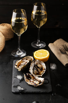Fresh oysters with lemon and a glass of wine