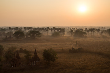 Sunrise over misty plain in Bagan, Myanmar (Burma).