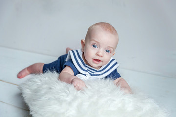 Baby sailor on the white pillow