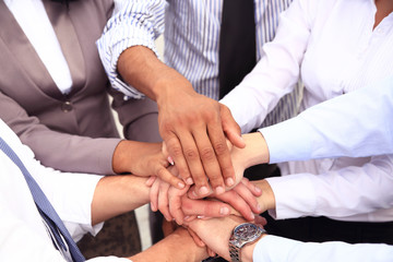 Group of Business People Join the Hand or United
