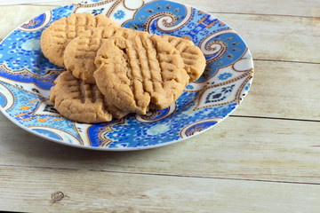 Homemade peanut butter cookies on colored plate