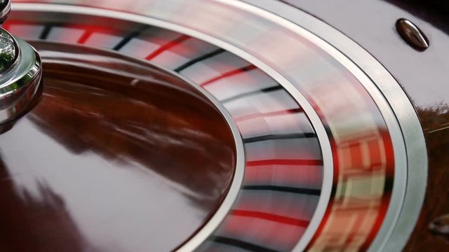 casino roulette wheel in motion. numbers on the roulette wheel close-up
