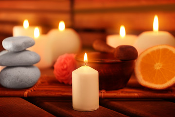 Fototapeta na wymiar Beautiful spa setting with candles on wooden background